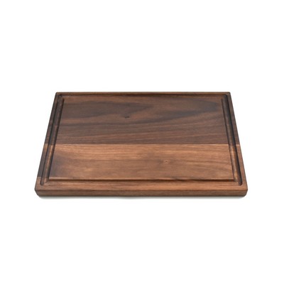 Small walnut board with rounded edges and juice groove